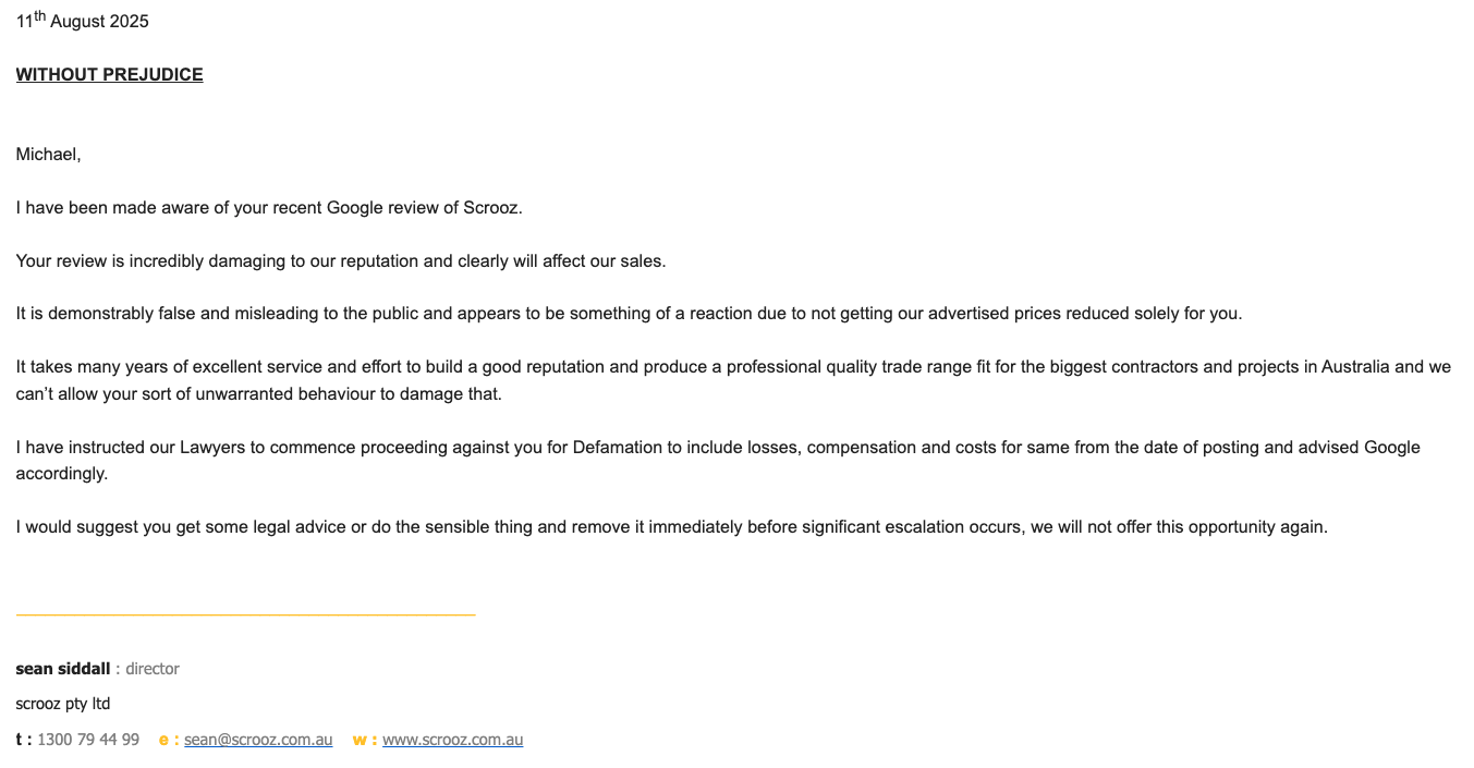 Screenshot of legal threat email from Scrooz director